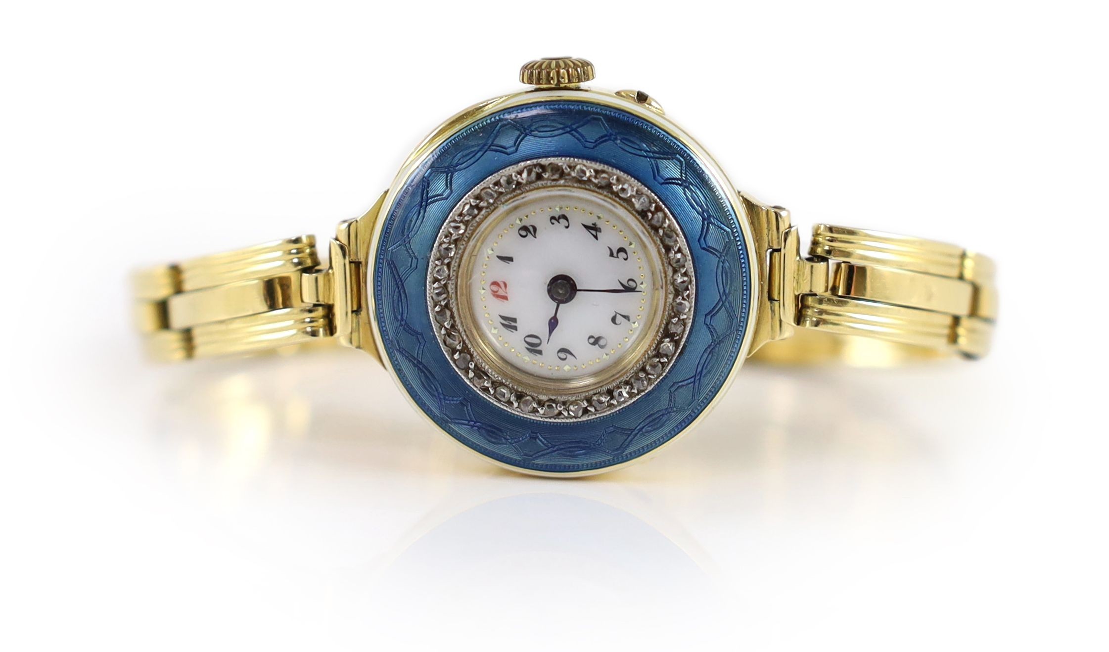 A lady's early to mid 20th century 18ct gold, enamel and diamond chip set manual wind wrist watch